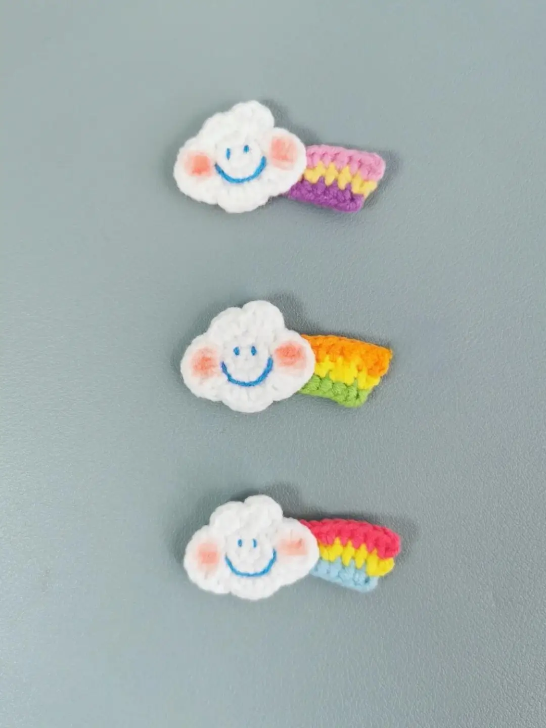 Crocheted cloud and rainbow hair clips.