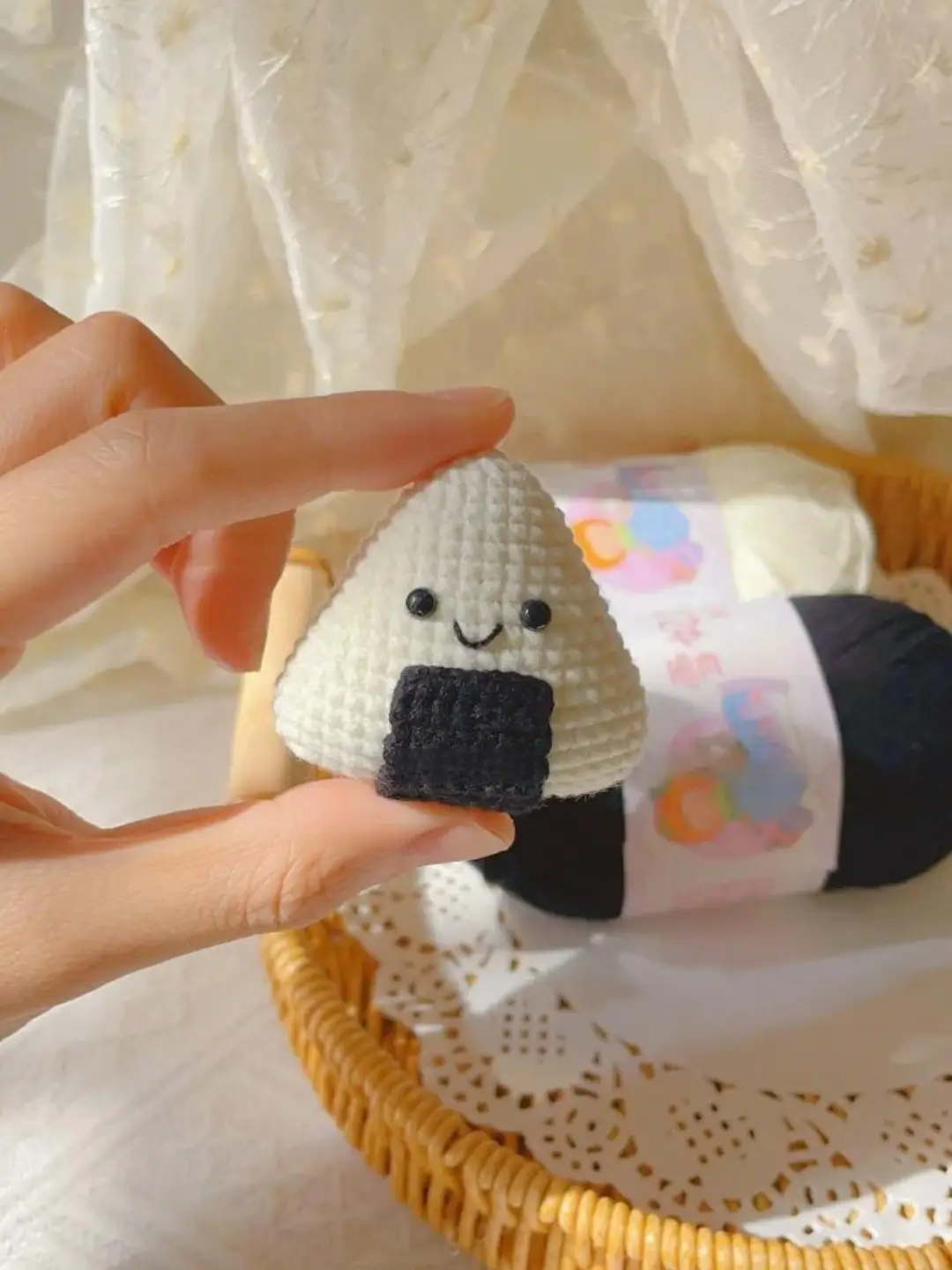 Crocheted onigiri, kawaii food, hand-held.