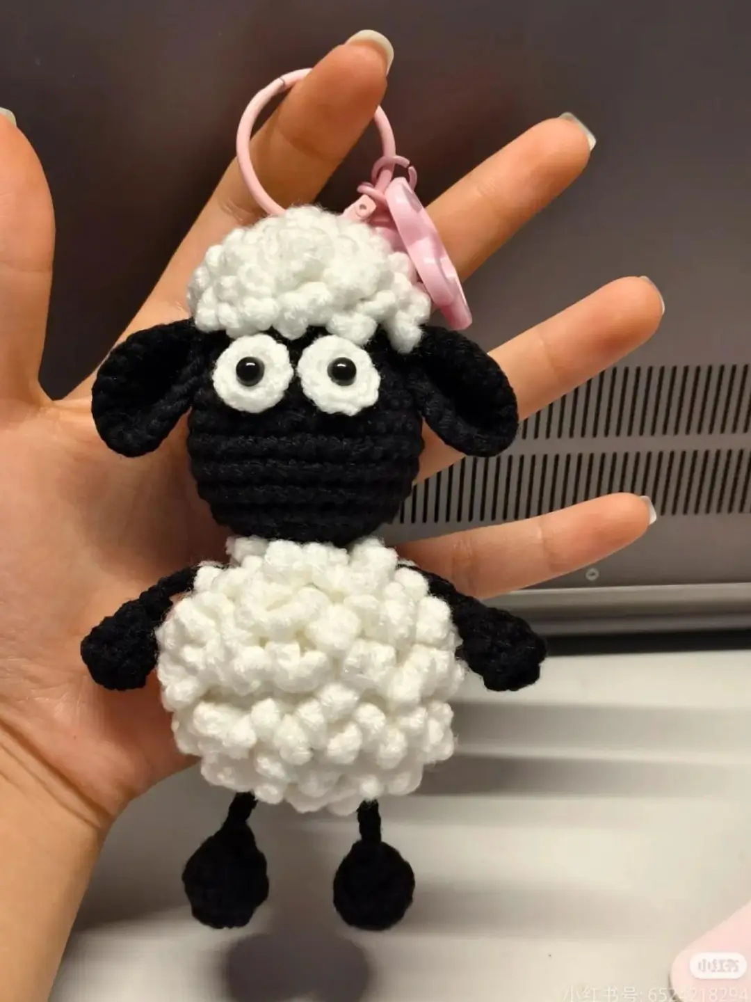Crocheted sheep keychain, black and white.