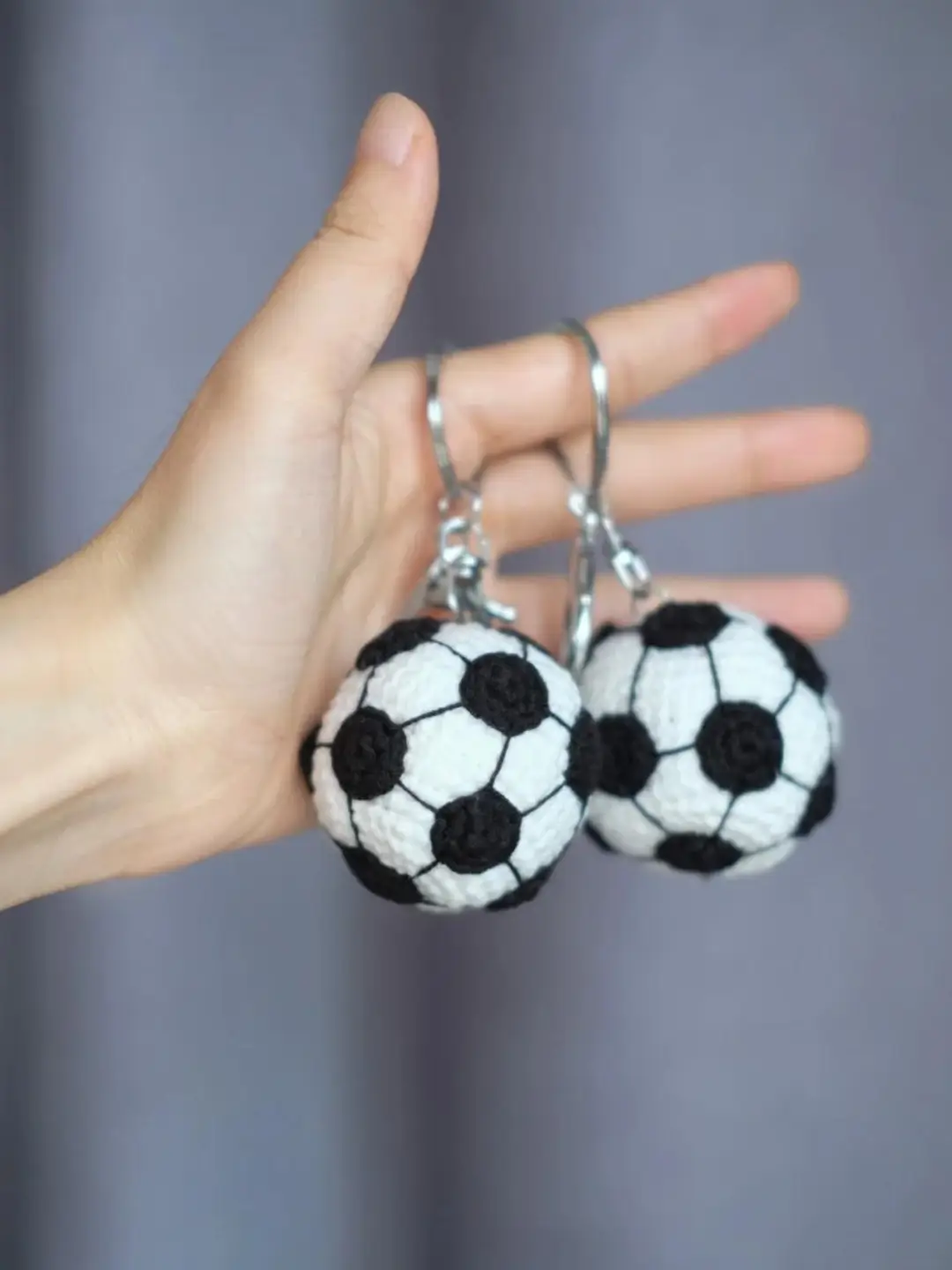 Crocheted soccer ball keychains.