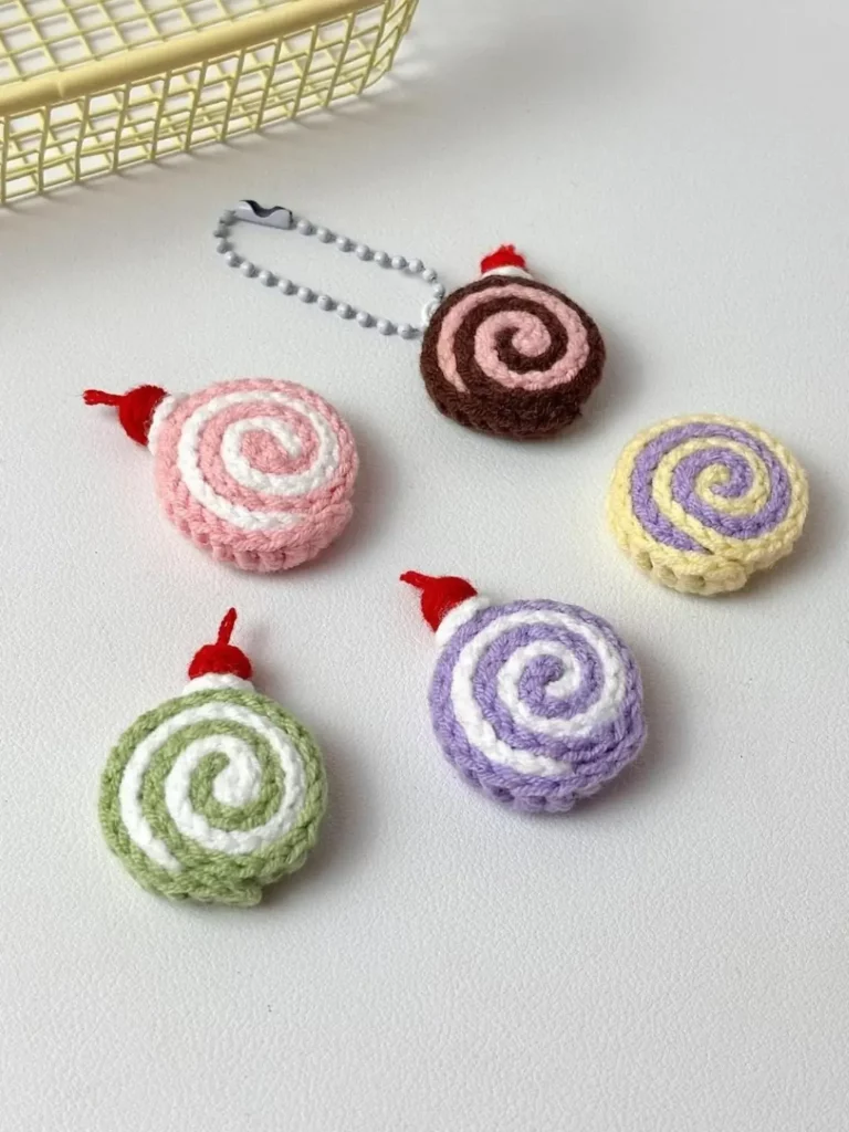 Crocheted swirl cake keychains, various colors.